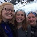 Hana, Becca and Hannah smile together in front of Exit Glacier.